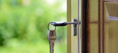 3 keys on the lock of the front door of a single family rental property